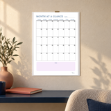 Actual month-at-a-glance calendar page from the PDF shown on a calm office wall.