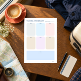 Actual six-day travel itinerary page with a notes area, shown on a café table beside travel items.