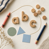 Preschool learning themes shown with letters, counting tokens, shapes and crayons