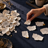 Original abstract thought-sorting metaphor with hand moving paper fragments; not workbook pages